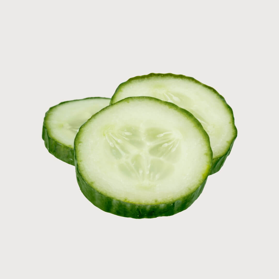 Three slices of cucumber on a white background