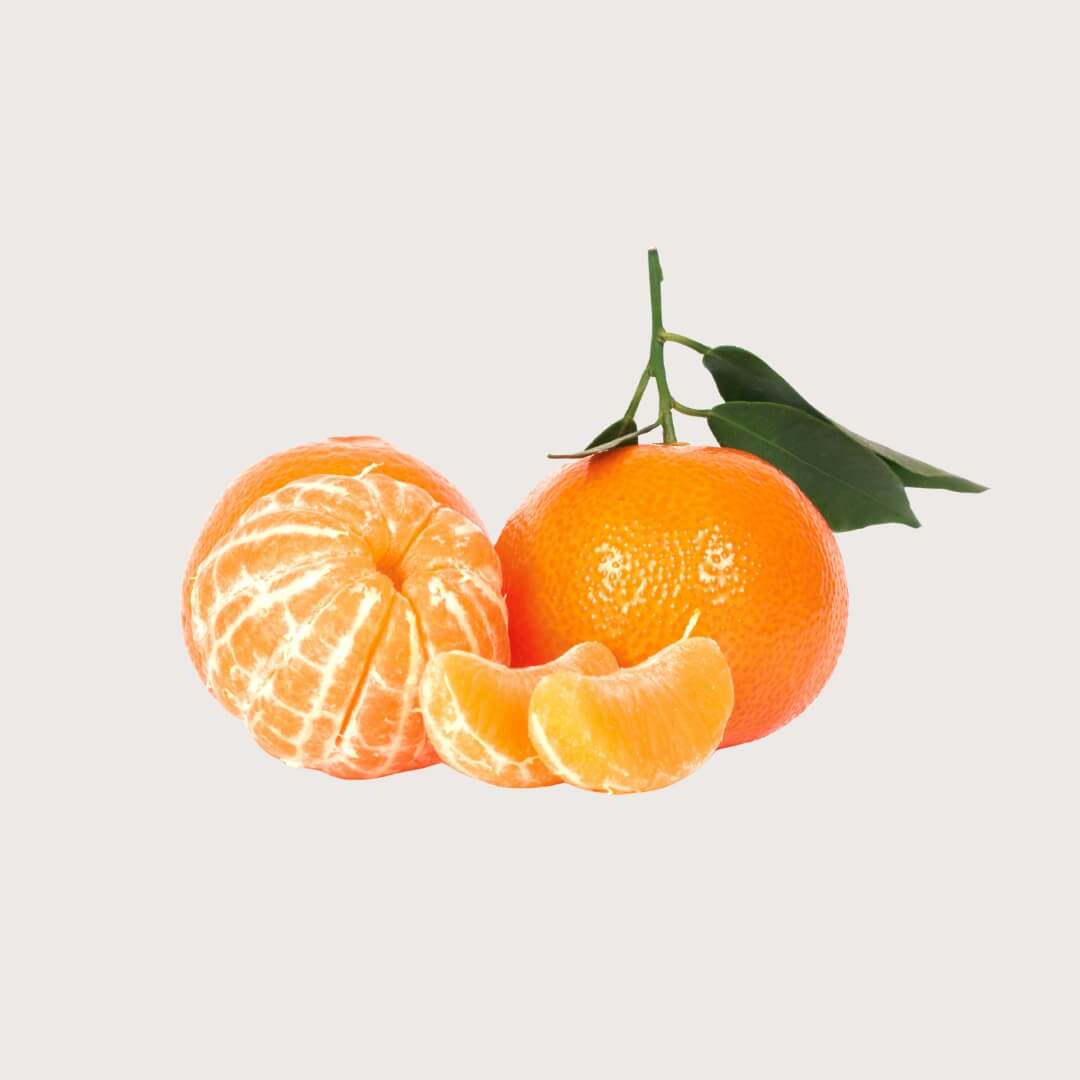Mandarins with one peeled on a light gray background
