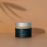 Jar of Reign Citrus Glow face moisturiser with 'reign' branding on a warm background