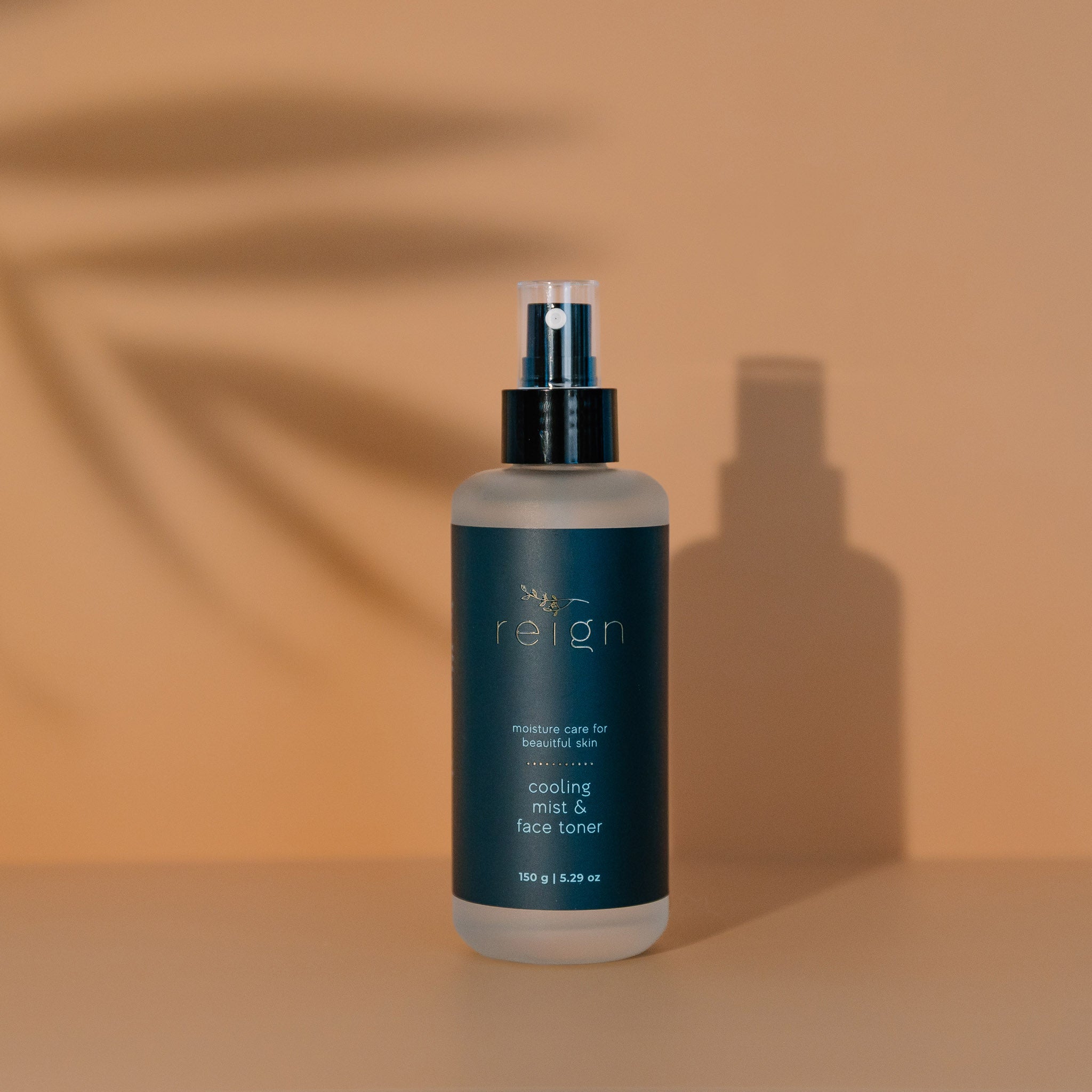 Skincare Reign Cooling Mist and face toner on a warm background